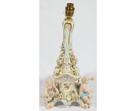 Meissen porcelain floral encrusted candlestick, with putti figures to the base, converted to a lamp, 38cm