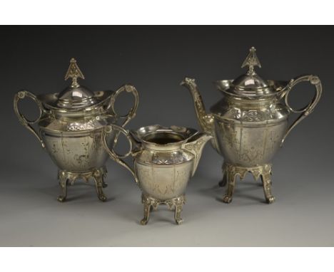 An Aesthetic Movement E.P.N.S three piece bachelor's tea service, comprising teapot, milk jug and sucrier, stylised pointed f