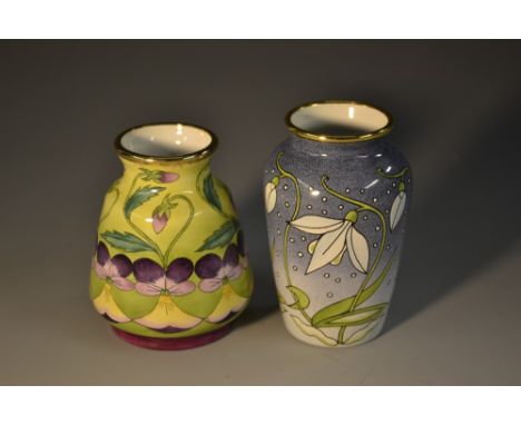 A Moorcroft  enamel ovoid vase, Snowdrops, 8cm high,  boxed;  another, Pansies, 8.5cm high, boxed 