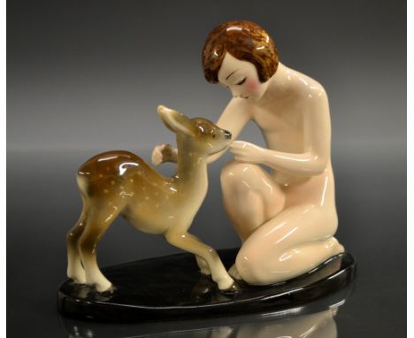 A Goldscheider figure,  of a kneeling naked girl with a faun, oval black base, 16cm high, shape no. 7218/70   Condition Repor