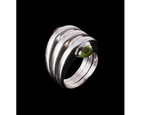 BULGARI, A PERIDOT AND PINK TOURMALINE DRESS RINGthe front with three spaced bands, with oval cabochon peridot and tourmaline