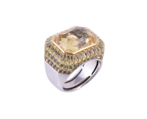 STEPHEN WEBSTER, A SPECIALLY COMMISSIONED YELLOW SAPPHIRE AND YELLOW STONE CLUSTER DRESS RINGthe rectangular facetted yellow 