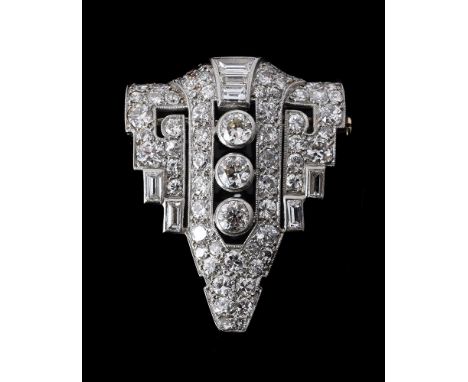 A FRENCH MID 20TH CENTURY DIAMOND BROOCHthe pierced geometric brooch set with old brilliant cut diamonds and baguette cut dia