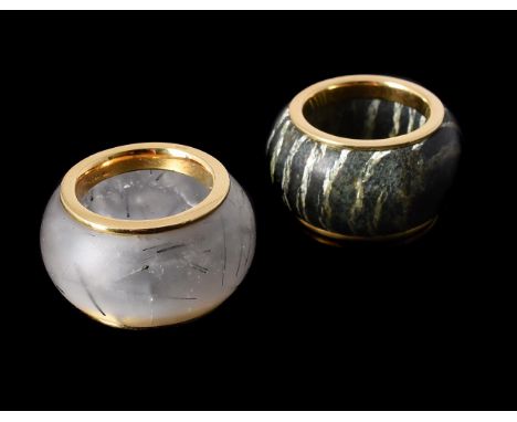 GRATIA SCOTT-OLDFIELD, TWO HARDSTONE BAND RINGSthe first with a banded veined hardstone, the gold coloured border stamped 750