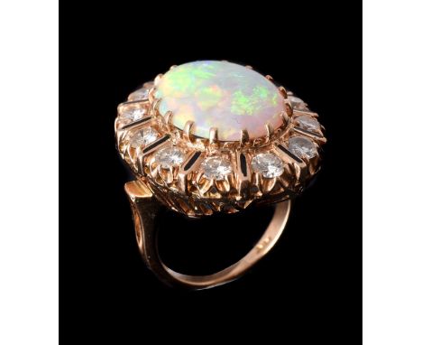 AN OPAL AND DIAMOND CLUSTER DRESS RINGthe oval cabochon opal within a surround of brilliant cut diamonds with black enamelled