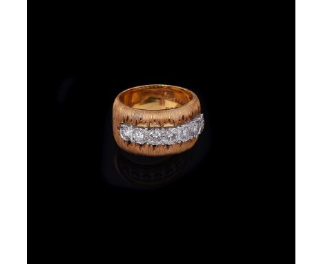 BUCCELLATI, A DIAMOND SET DRESS RINGthe textured broad band with a pierced section set with a row of brilliant cut diamonds, 