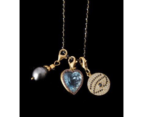 A BLACK DIAMOND CHAIN WITH A TRIO OF PENDANTSthe chain with facetted black diamond spacers, suspending three charms, comprisi