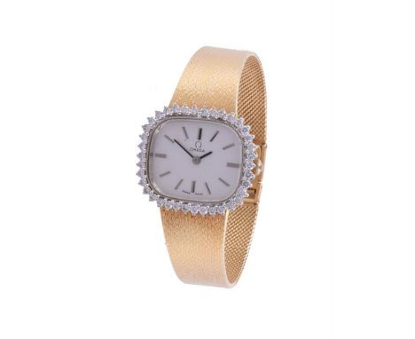 OMEGA, A LADY'S TWO COLOUR 18 CARAT GOLD AND DIAMOND BRACELET WATCH, CIRCA 1984Movement: Cal. 1070, manual windCase: 18 carat