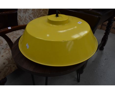 A modern commercial style ceiling light fitting in yellow