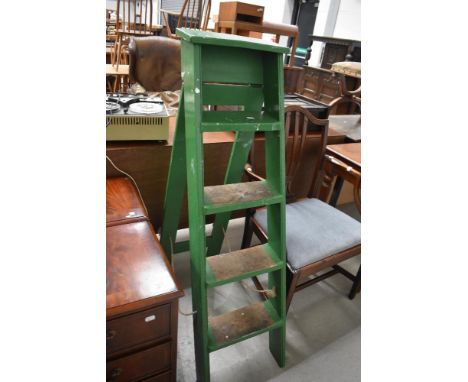 A set of traditional wooden step ladders