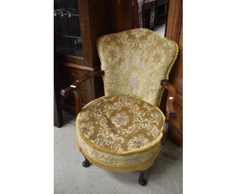 A vintage easy arm chair