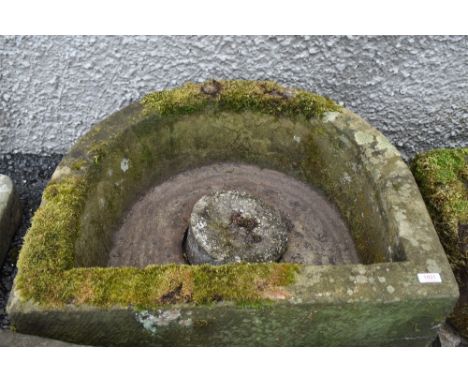 A large farm house style stone carved half moon water trough or feeder with cast plug, extremely heavy approx W74cm D63cm H35