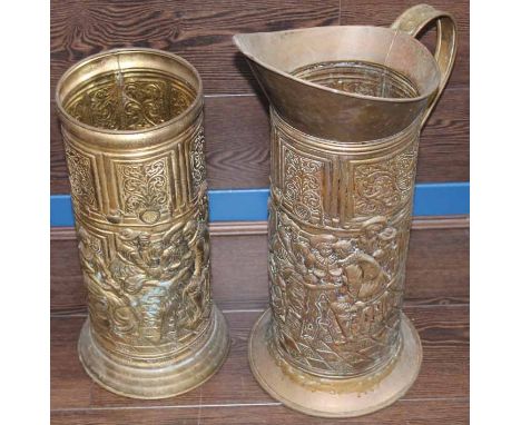 TWO BRASS EMBOSSED STICK STANDS