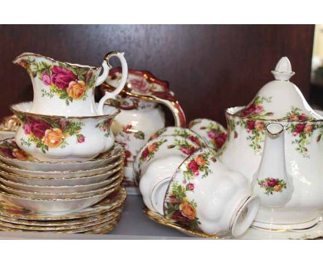 ROYAL ALBERT OLD COUNTRY ROSES TEA SET
with six cups, saucers, plates, sugar, cream and tea pot; two together with a pink Mas