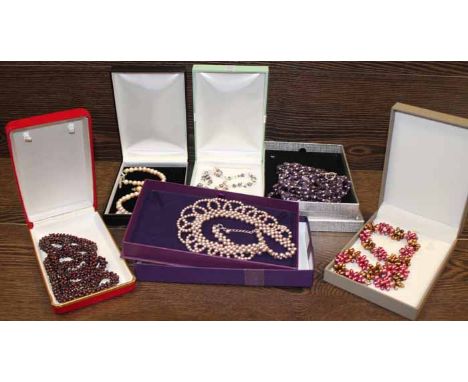 GROUP OF FIVE PEARL AND BEAD NECKLACES
including a garnet bead necklace and along with a pair of pearl stud earrings to match
