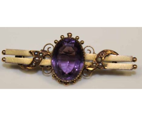 VICTORIAN AMETHYST AND SEED PEARL BAR BROOCH
with a central large oval amethyst, hallmarked for nine carat gold on reverse, o