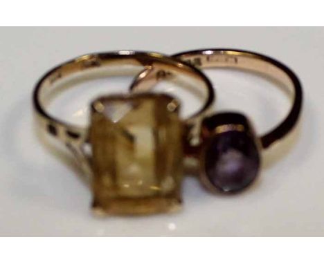 AMETHYST RING AND A CITRINE RING
both set in nine carat gold, condition fair overall