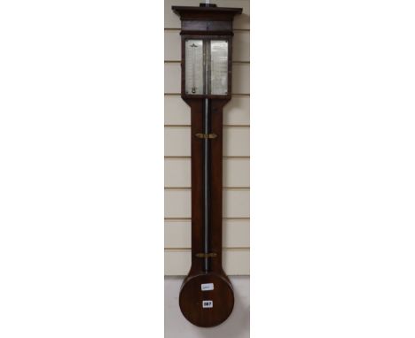 A mahogany stick barometer by G. Negretti, 4 Withy Grove, Manchester, with silvered scales and circular reservoir cover H.100