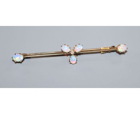 An Edwardian 15ct, white opal and diamond set cluster bar brooch, 58mm.