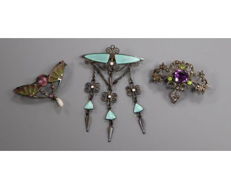 An Art Deco plique a jour brooch, a Norwegian enamel brooch and one other brooch.