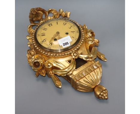 A Swedish giltwood cartel clock