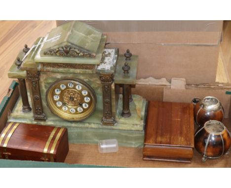 A French onyx mantel clock, two cigarette boxes and two nutshell vases