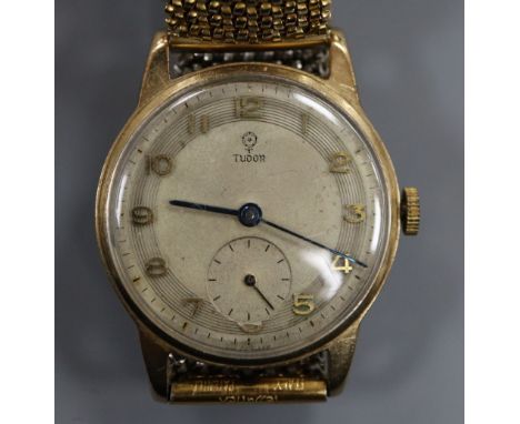 A gentleman's 1950's 9ct gold Tudor mid-size manual wind wrist watch, on associated flexible strap.