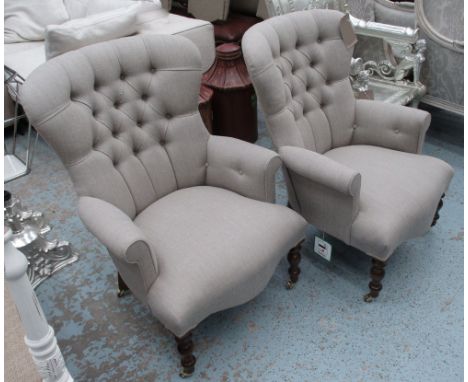 ARMCHAIRS, a pair, button back in a neutral fabric on turned castor support, 65cm. (2)