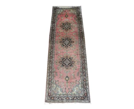 FINE SILK TABRIZ RUNNER, 247cm x 78cm, triple pole medallions on a light terracotta field inside jade spandrels and a midnigh