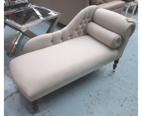 CHAISE LONGUE, button back in neutral fabric on turned castor supports, 131cm L.