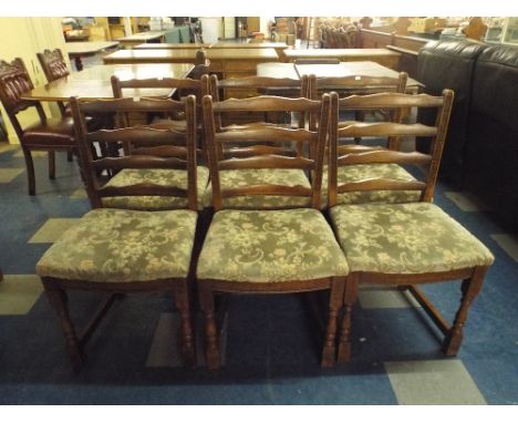 A Set of Six Ladder Back Dining Chairs.
