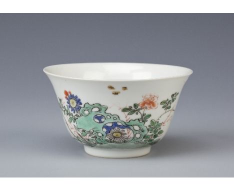 A CHINESE FAMILLE VERTE TEA BOWL KANGXI 1662-1722 The gently flared body painted with insects and sprays of flowers sprouting
