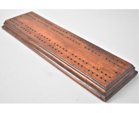 A Late Victorian Mahogany Cribbage Board, 32cms Long and 10cms Wide 