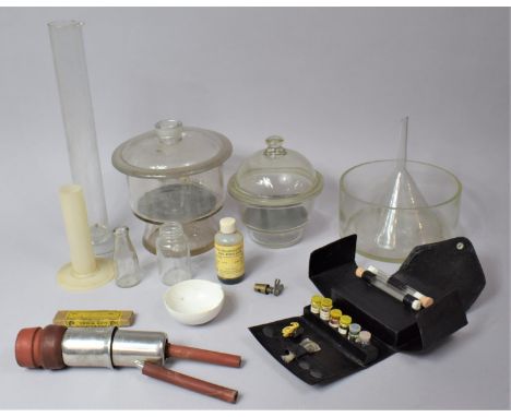 A Collection of Various Chemists Equipment to Include Measuring Flask, Funnels, Lidded Pots etc 