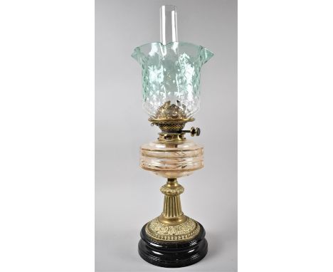 A Late Victorian Brass Based Oil Lamp with Glass Reservoir and Green Glass Wavy Rimmed Shade, 60cms High 