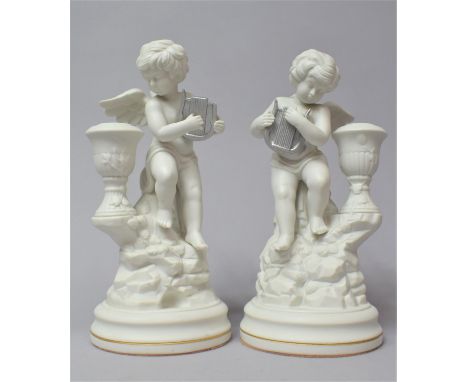 A Pair of Franklin Mint Italian Style Cherub Candlesticks, One with Harp AF, 22.5cm high 