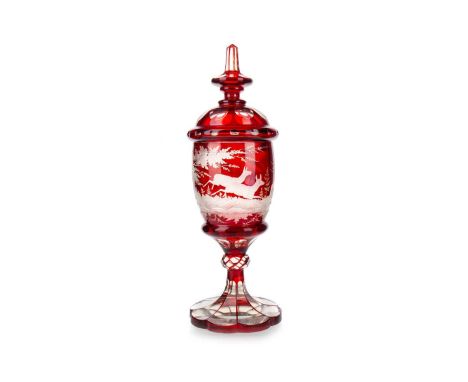 BOHEMIAN RUBY FLASHED GLASS GOBLET AND COVER, LATE 19TH / EARLY 20TH CENTURY  the curved cylindrical body wheel engraved with