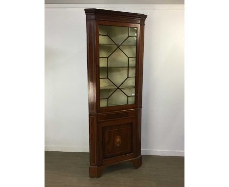 GEORGE III MAHOGANY CORNER CABINET, the astragal glazed door enclosing three shelves, the lower cupboard door with marquetry 