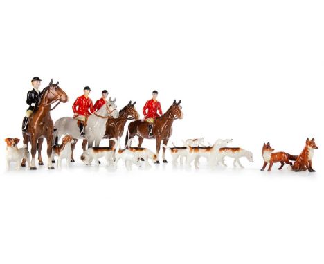 BESWICK FOX HUNTING SET, comprising three larger huntsmen and one huntswoman, one on dappled grey mount, nine hounds and one 