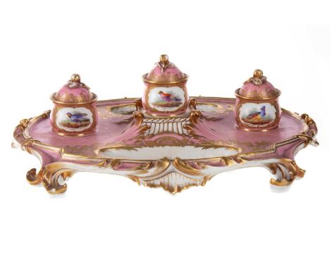 CONTINENTAL PORCELAIN DESK INK STAND, LATE 19TH CENTURY   with three lidded pots set into an oval base, painted with reserves