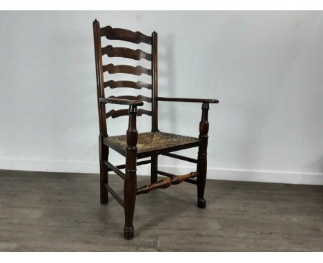SET OF EIGHT ELM LADDER BACK DINING CHAIRS, OF GEORGE III DESIGN with rush seats, raised on turned front supports to pad feet