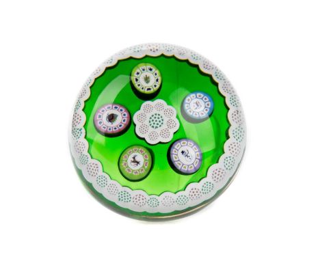 PERTHSHIRE CHRISTMAS PAPERWEIGHT, 1981 set with five festive canes within a white border to a green ground, signed cane to ba