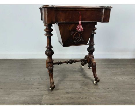 VICTORIAN WALNUT SEWING TABLE, LATE 19TH CENTURY  the shaped rectangular top over a frieze drawer and sliding compartment, on