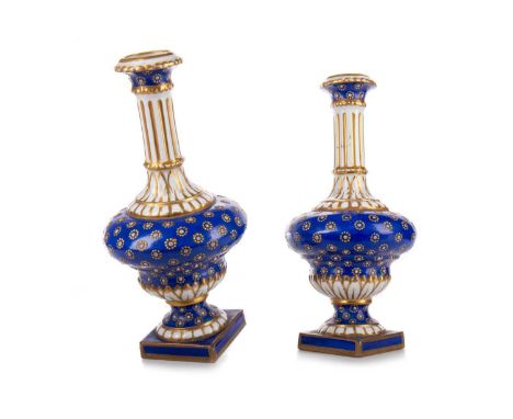 PAIR OF SEVRES PORCELAIN VASES, 19TH CENTURY decorated with gilt and enamel on a white and blue ground, marked to bases17.5cm