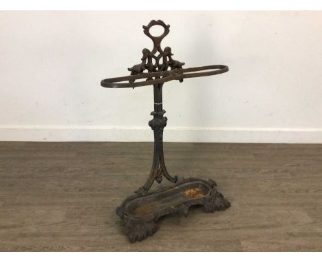 VICTORIAN CAST IRON UMBRELLA/STICK STAND, decorated with foliate designs in relief51cm wide 