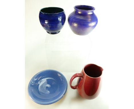 A collection of early William Moorcroft pottery items including Flamminian jug, lustred ribbed vase, powder blue plate and ri