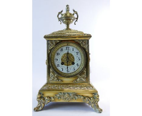 19th century brass mantle clock, the ornate brass case with a two handled urn mounted to the top with carrying handles, heigh