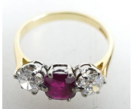 18ct Ruby and Diamond Ring. Two tiny drops of glue present on the two centre claws of the ruby, as ruby had become slightly l