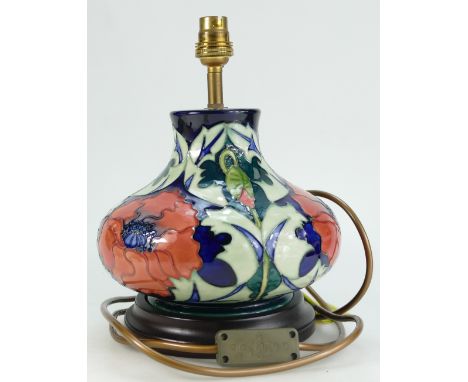 Moorcroft squat Lamp base decorated with a Poppy design by Rachel Bishop, height 18.5cm on wooden plinth.