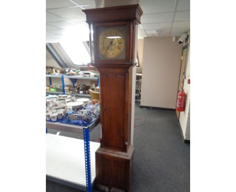 A 19th Century 30 hour oak longcase clock, the brass dial signed Jonathan Graham, with pendulum and weights. 